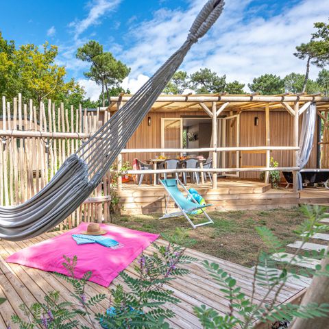 Mobilheim 4 Personen - Garden 2ch-CLIM-Badewanne-TV-LV-Plancha-überdachte Terrasse-31m² | PREMIUM