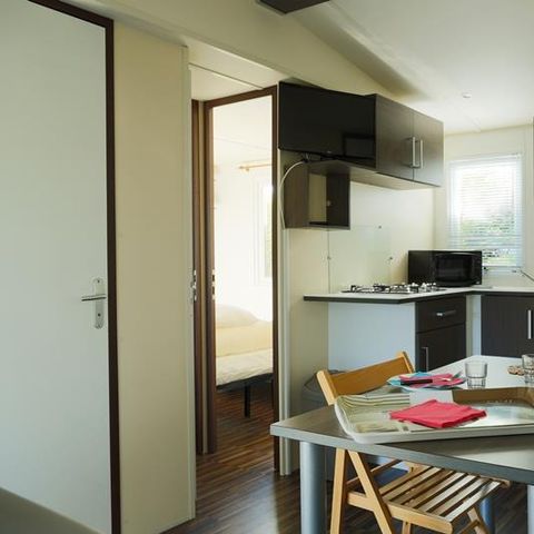 Mobilheim 2 Personen - Mobilheim Strand 18.6m² (+ 10 Jahre) (1 Zimmer) + Halbüberdachte Holzterrasse + TV 2 Pers.